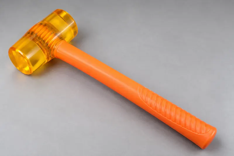 Plastic hammer with translucent amber head and orange handle